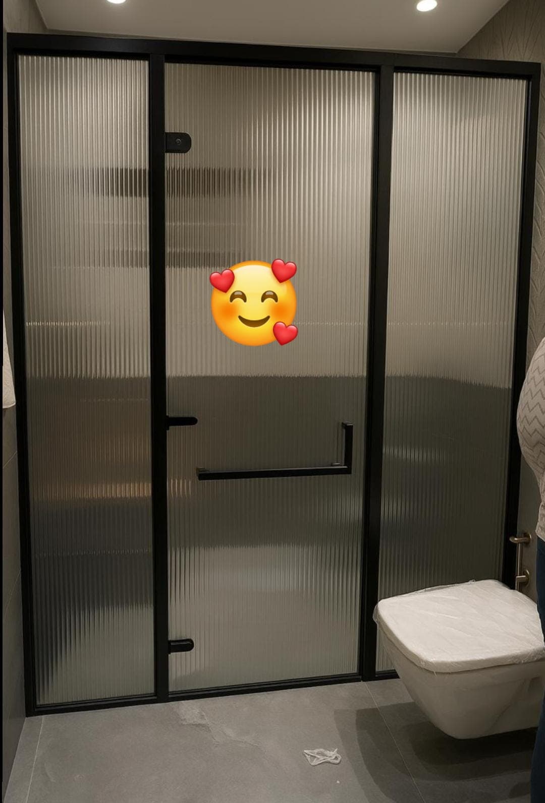 Sliding glass shower enclosure with a clean, sealed edge